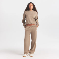 COTTON FLEECE CLASSIC HOODIE | LATTE ON A MODEL FRONT VIEW @ | FOCUS: 0.0, 1.0, 0.9