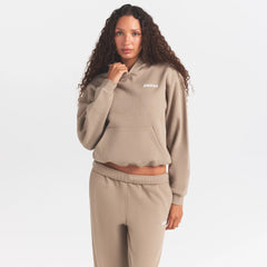 COTTON FLEECE CLASSIC HOODIE | LATTE ON A MODEL SIDE VIEW @ | FOCUS: 0.0, 1.0, 0.9