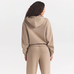 COTTON FLEECE CLASSIC HOODIE | LATTE ON A MODEL SIDE VIEW @ | FOCUS: 0.0, 1.0, 0.9