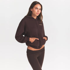 COTTON FLEECE ZIP UP HOODIE WITH EMBOSSED LOGO | ESPRESSO ON A MODEL SIDE VIEW @ | FOCUS: 0.0, 1.0, 0.9