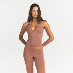 SMOOTH LAYERS HALTER TOP | NUTMEG ON A MODEL FRONT VIEW @ | FOCUS: 0.0, 1.0, 0.9