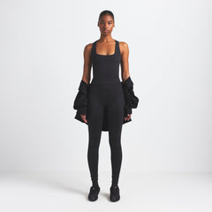 NikeSKIMS VINTAGE SEAMLESS RACER BACK TANK | OBSIDIAN ON A MODEL FRONT VIEW @ | FOCUS: 0.9, 0.1, 0.7