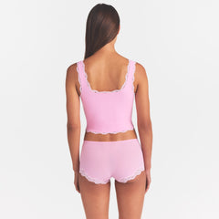 FITS EVERYBODY LACE TANK | BUBBLE GUM TONAL ON A MODEL SIDE VIEW @ | FOCUS: 0.0, 1.0, 0.9