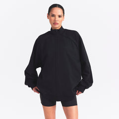 NikeSKIMS MATTE TRICOT OVERSIZED TRACK JACKET | OBSIDIAN ON A MODEL SIDE VIEW @ | FOCUS: 0.0, 1.0, 0.9