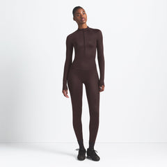 NikeSKIMS SHINE LONG SLEEVE HALF ZIP | PHOENIX ON A MODEL FRONT VIEW @ | FOCUS: 0.9, 0.1, 0.7