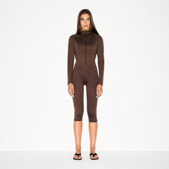 NikeSKIMS MATTE MOCK NECK FULL ZIP JACKET | DARK SEPIA ON A MODEL FRONT VIEW @ | FOCUS: 0.0, 1.0, 0.9