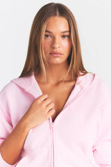 COTTON FLEECE CLASSIC ZIP UP HOODIE | CHERRY BLOSSOM ON A MODEL SIDE VIEW @ | FOCUS: 0.0, 1.0, 0.9