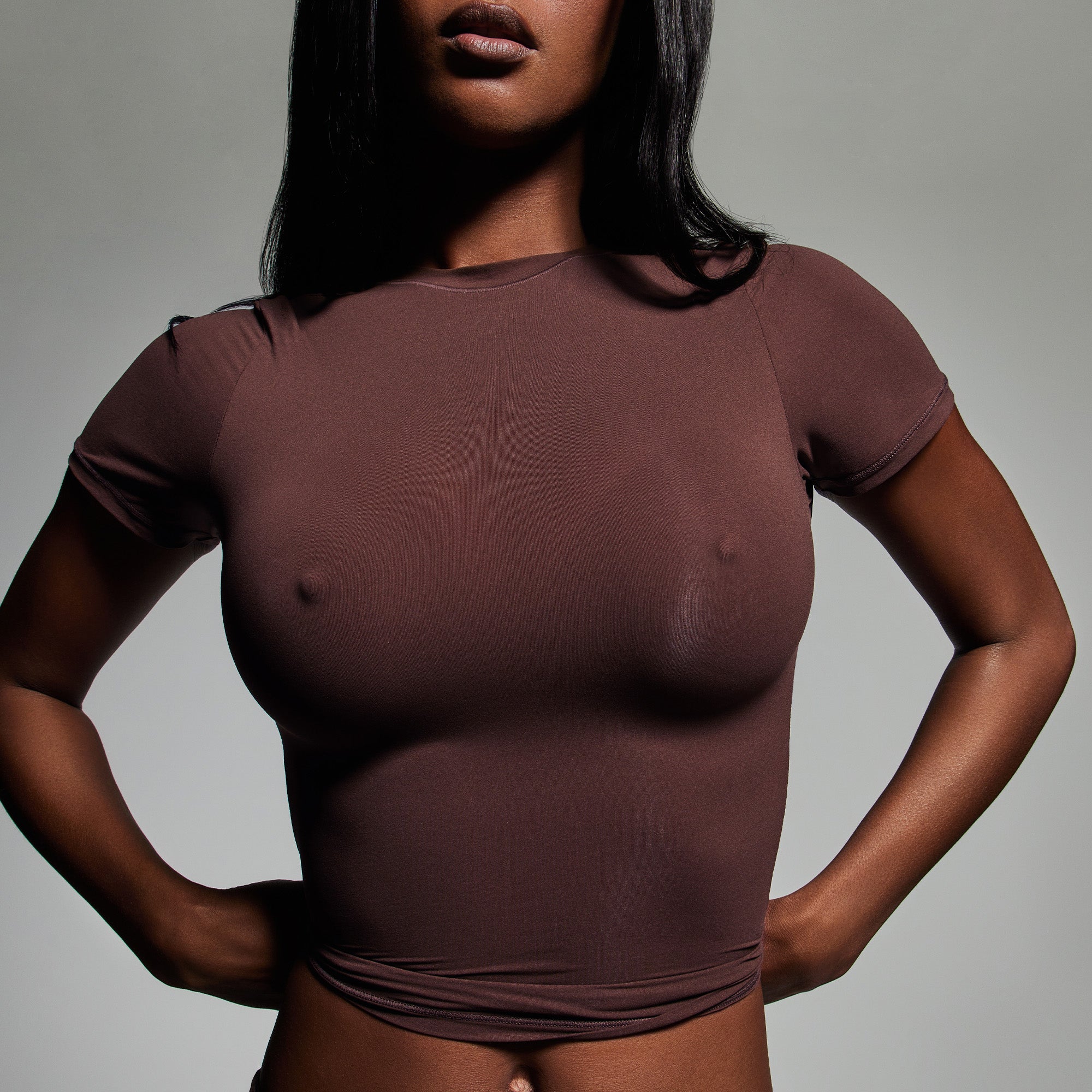 SKIMS ULTIMATE NIPPLE PUSH-UP BRA WORN BY A MODEL IN CAMPAIGN IMAGERY