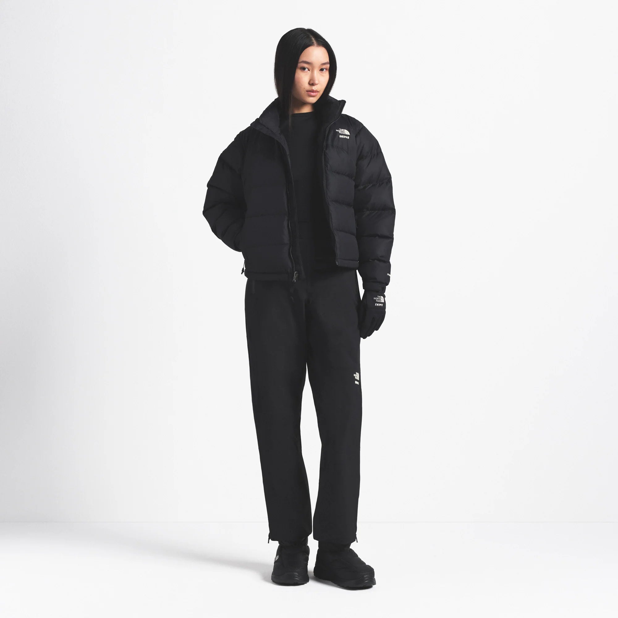 THE NORTH FACE X SKIMS 2000 RETRO NUPTSE JACKET | ONYX ON A MODEL FRONT VIEW @ | FOCUS: 0.0, 1.0, 0.9