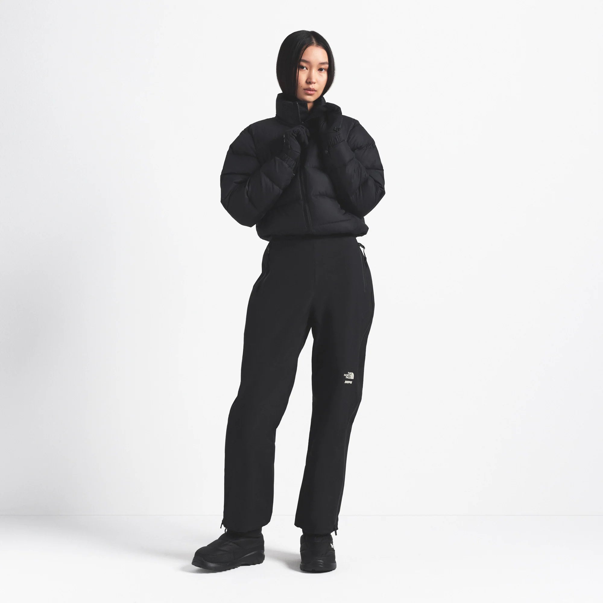 THE NORTH FACE X SKIMS 2000 RETRO NUPTSE JACKET | ONYX ON A MODEL FRONT VIEW @ | FOCUS: 0.0, 1.0, 0.9