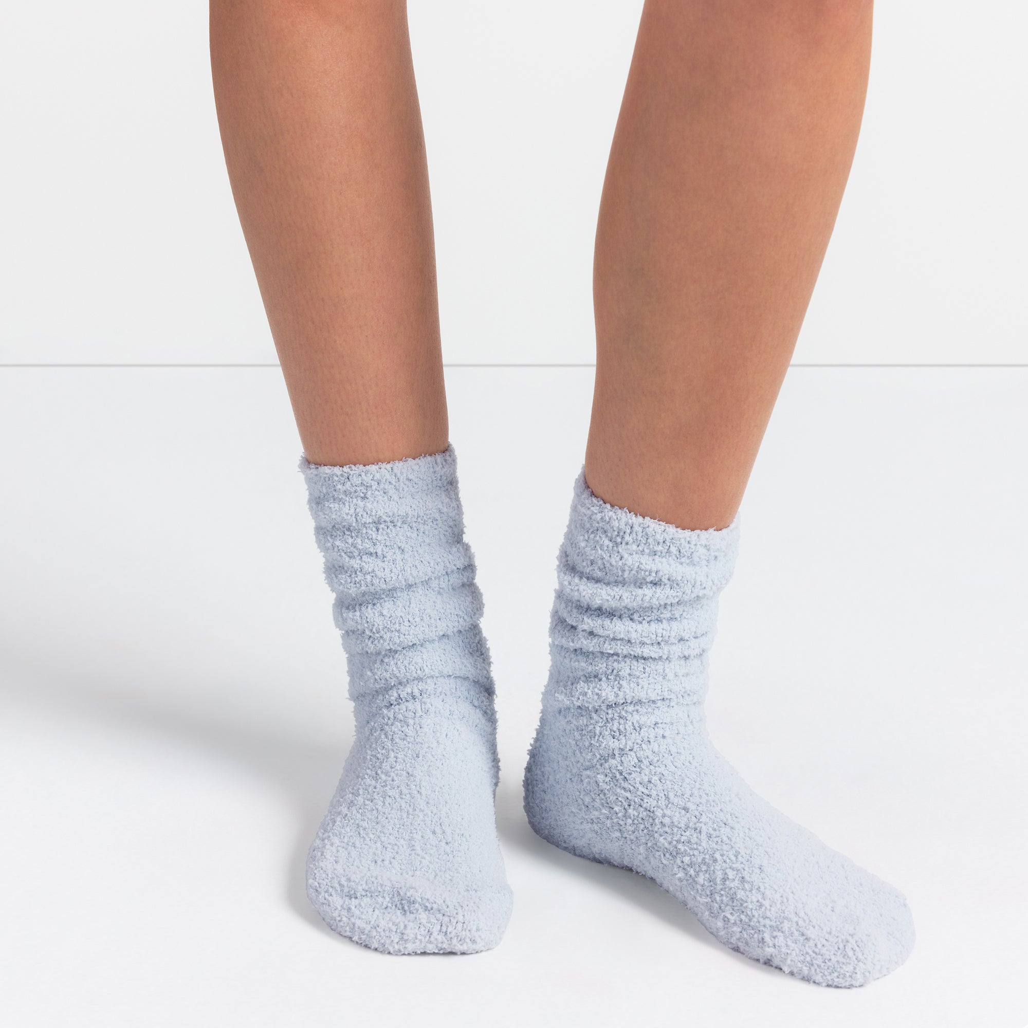 COZY KNIT SOCK | ZEN BLUE ON A MODEL SIDE VIEW @ | FOCUS: 0.0, 1.0, 0.9