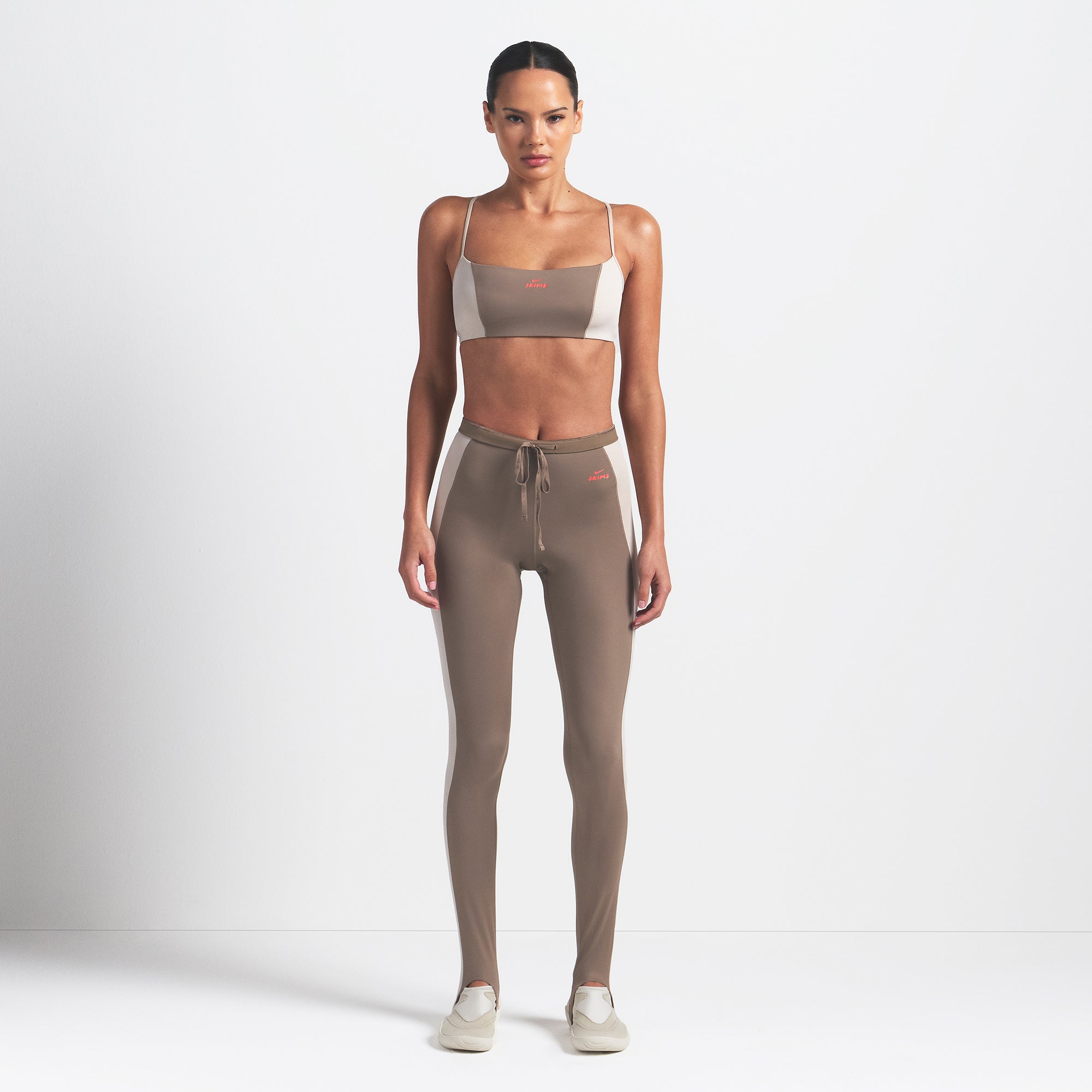 NikeSKIMS SHINE MICRO SCOOP BRA | TRUFFLE AND STONE ON A MODEL FRONT VIEW @ | FOCUS: 0.0, 1.0, 0.9