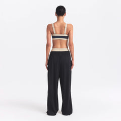 NikeSKIMS MATTE AND SHINE STRAIGHT NECK BRA | DEEP ROYAL/STONE ON A MODEL SIDE VIEW @ | FOCUS: 0.0, 1.0, 0.9