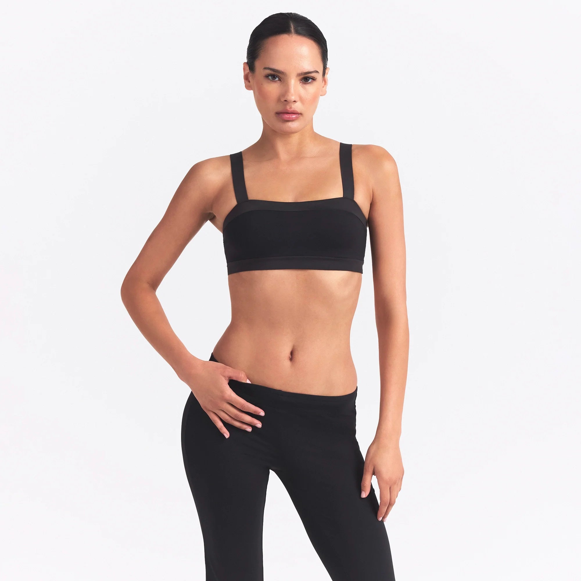 NikeSKIMS MATTE AND SHINE STRAIGHT NECK BRA | OBSIDIAN/IGNEOUS ON A MODEL SIDE VIEW @ | FOCUS: 0.0, 1.0, 0.9