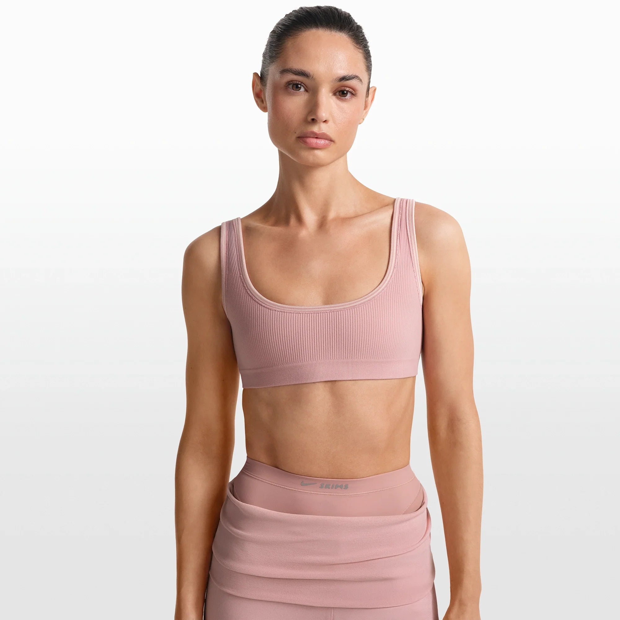NikeSKIMS RIBBED SEAMLESS MICRO SCOOP BRA | HIMALAYAN ON A MODEL FRONT VIEW @ | FOCUS: 0.0, 1.0, 0.9