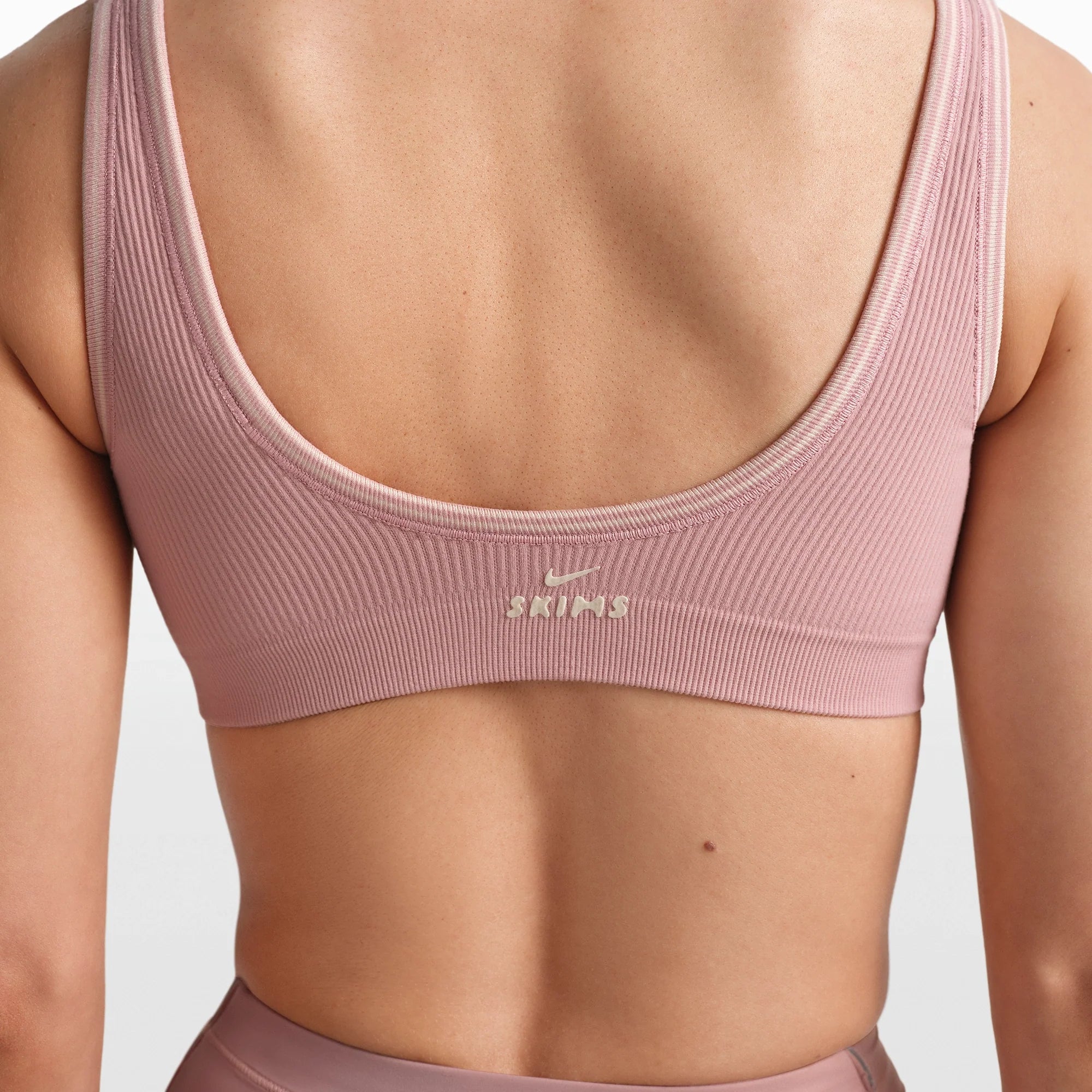 NikeSKIMS RIBBED SEAMLESS MICRO SCOOP BRA | HIMALAYAN/ECRU ON A MODEL FRONT VIEW @ | FOCUS: 0.0, 1.0, 0.9