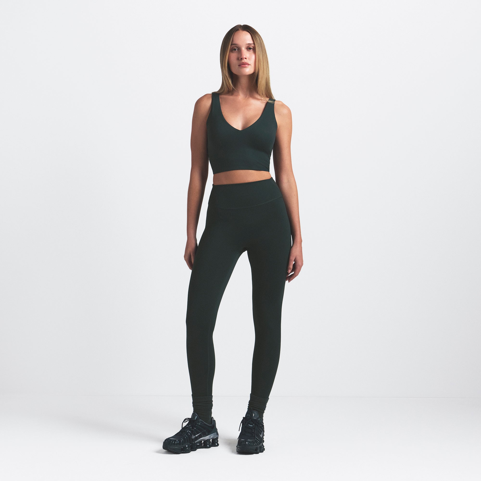 NikeSKIMS MATTE V-NECK BRA TOP | DARK TEAL ON A MODEL FRONT VIEW @ | FOCUS: 0.0, 1.0, 0.9