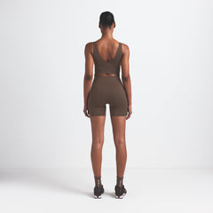 NikeSKIMS MATTE V-NECK BRA TOP | DARK SEPIA ON A MODEL BACK VIEW