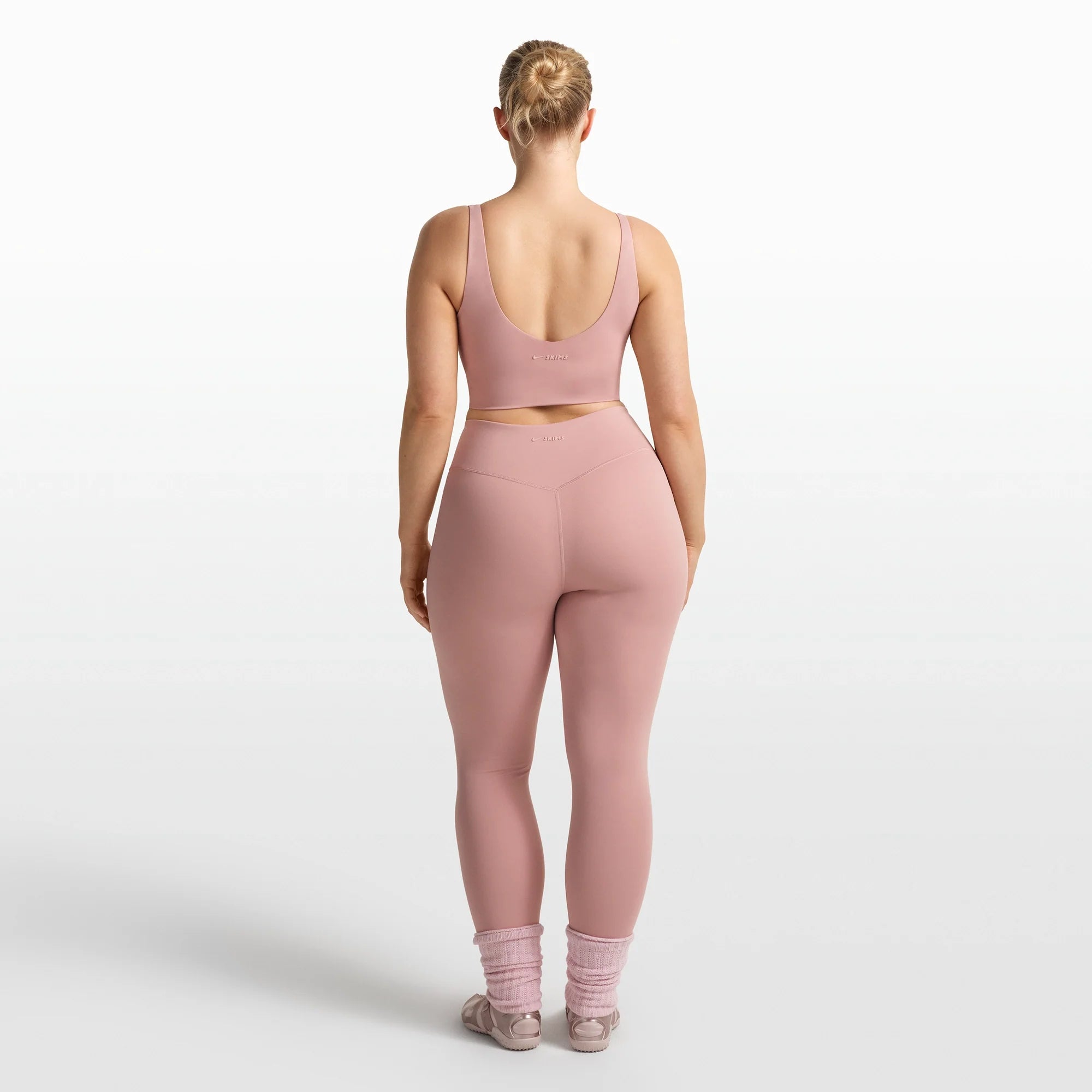 NikeSKIMS MATTE V-NECK BRA TOP | HIMALAYAN ON A MODEL FRONT VIEW @ | FOCUS: 0.0, 1.0, 0.9