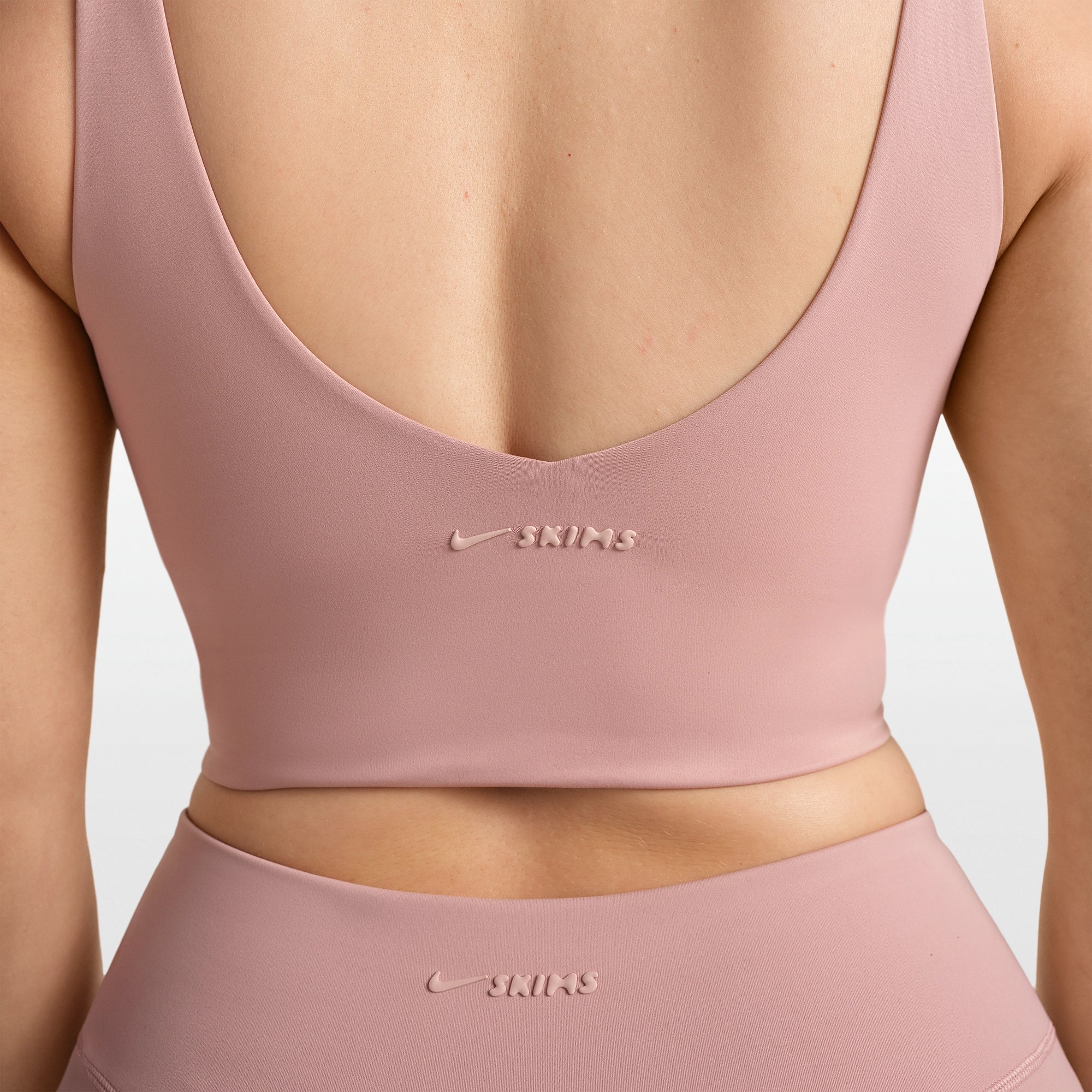NikeSKIMS MATTE V-NECK BRA TOP | HIMALAYAN ON A MODEL FRONT VIEW @ | FOCUS: 0.0, 1.0, 0.9