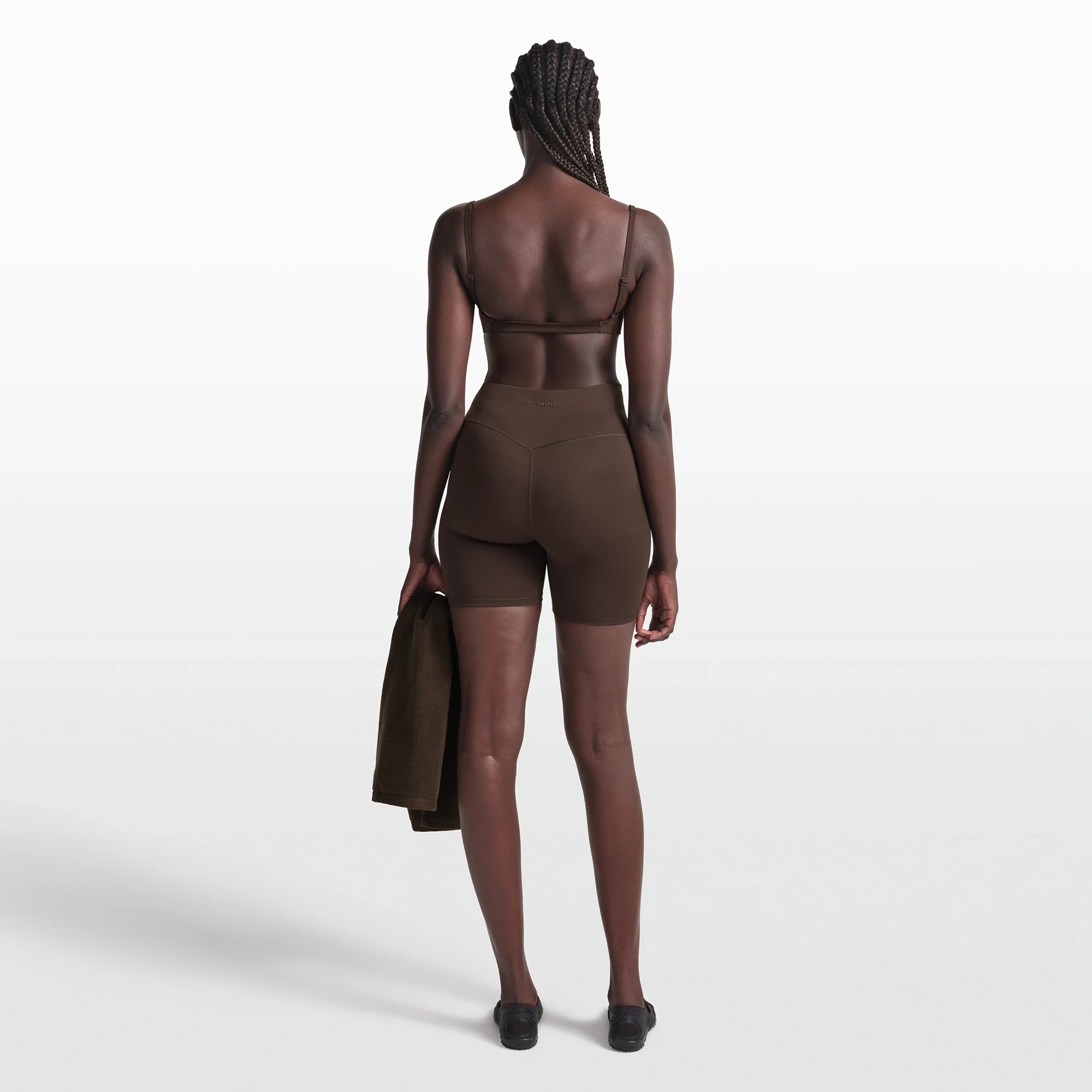 NikeSKIMS MATTE MICRO BRA | DARK SEPIA ON A MODEL FRONT VIEW @ | FOCUS: 0.0, 1.0, 0.9