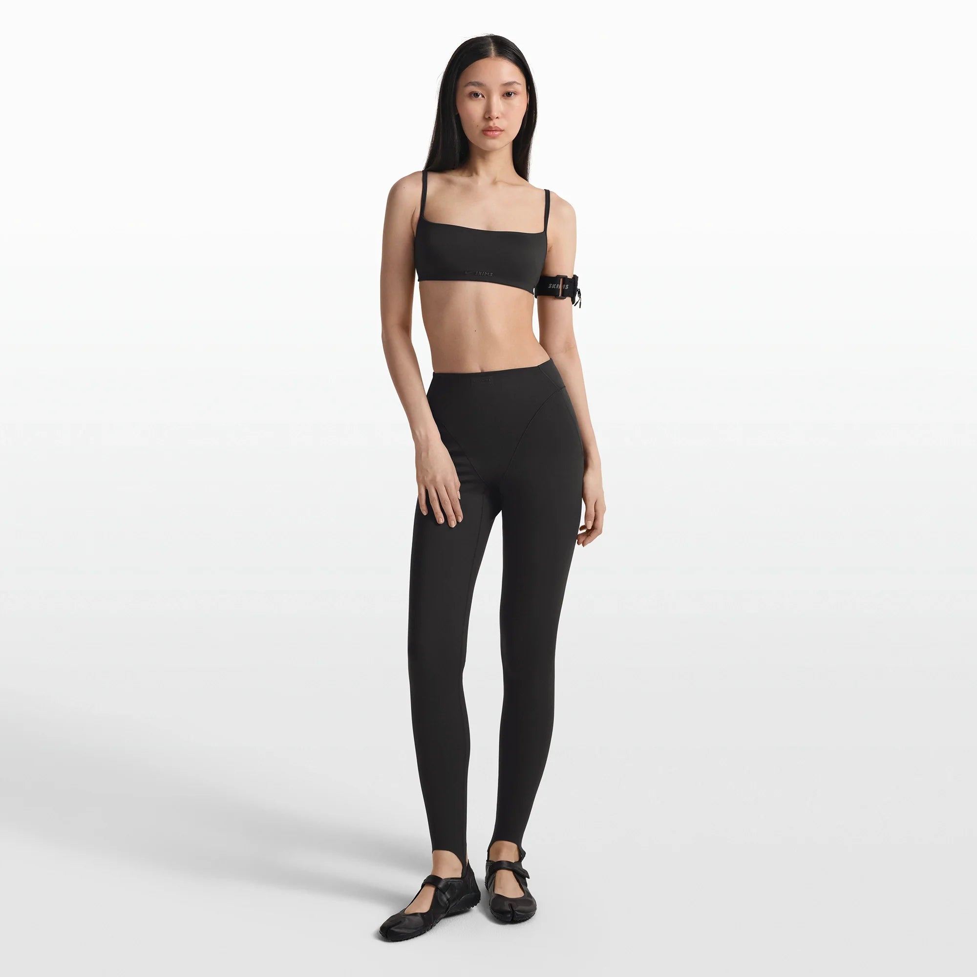 NikeSKIMS MATTE MICRO BRA | OBSIDIAN ON A MODEL FRONT VIEW @ | FOCUS: 0.0, 1.0, 0.9