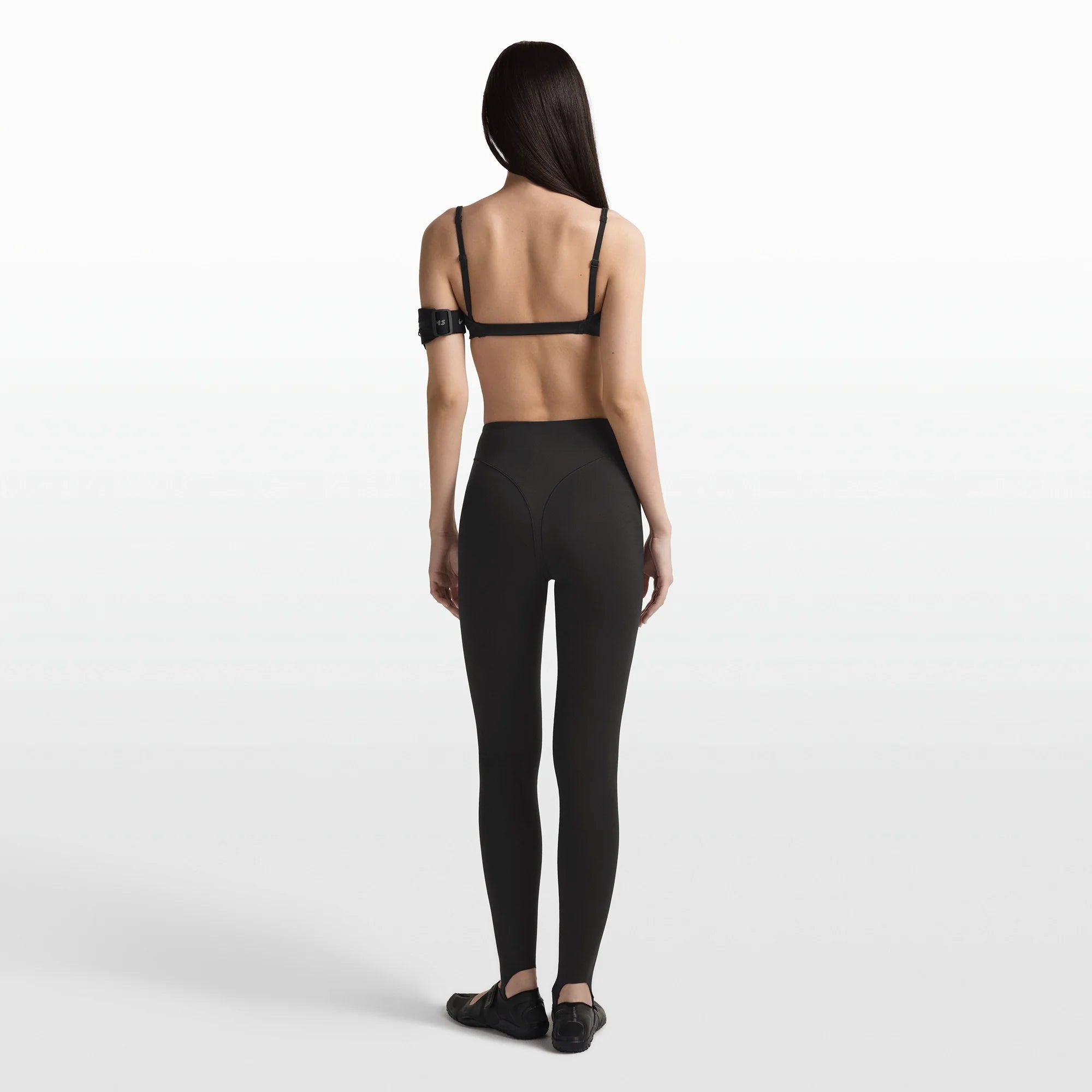 NikeSKIMS MATTE MICRO BRA | OBSIDIAN ON A MODEL FRONT VIEW @ | FOCUS: 0.0, 1.0, 0.9