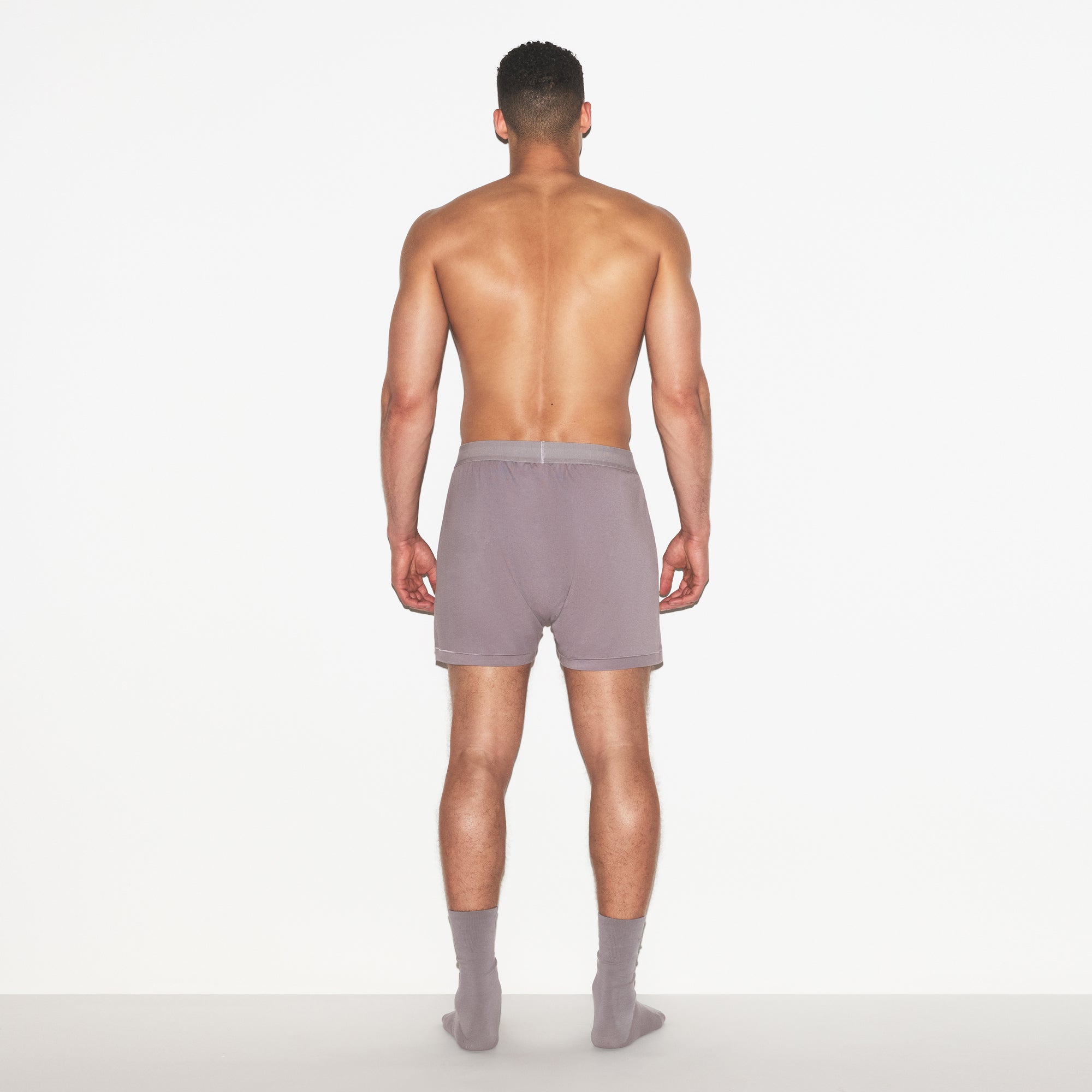 SKIMS COTTON MENS KNIT BOXER | ZINC ON A MODEL FRONT VIEW | FOCUS: 0.0, 1.0, 0.9