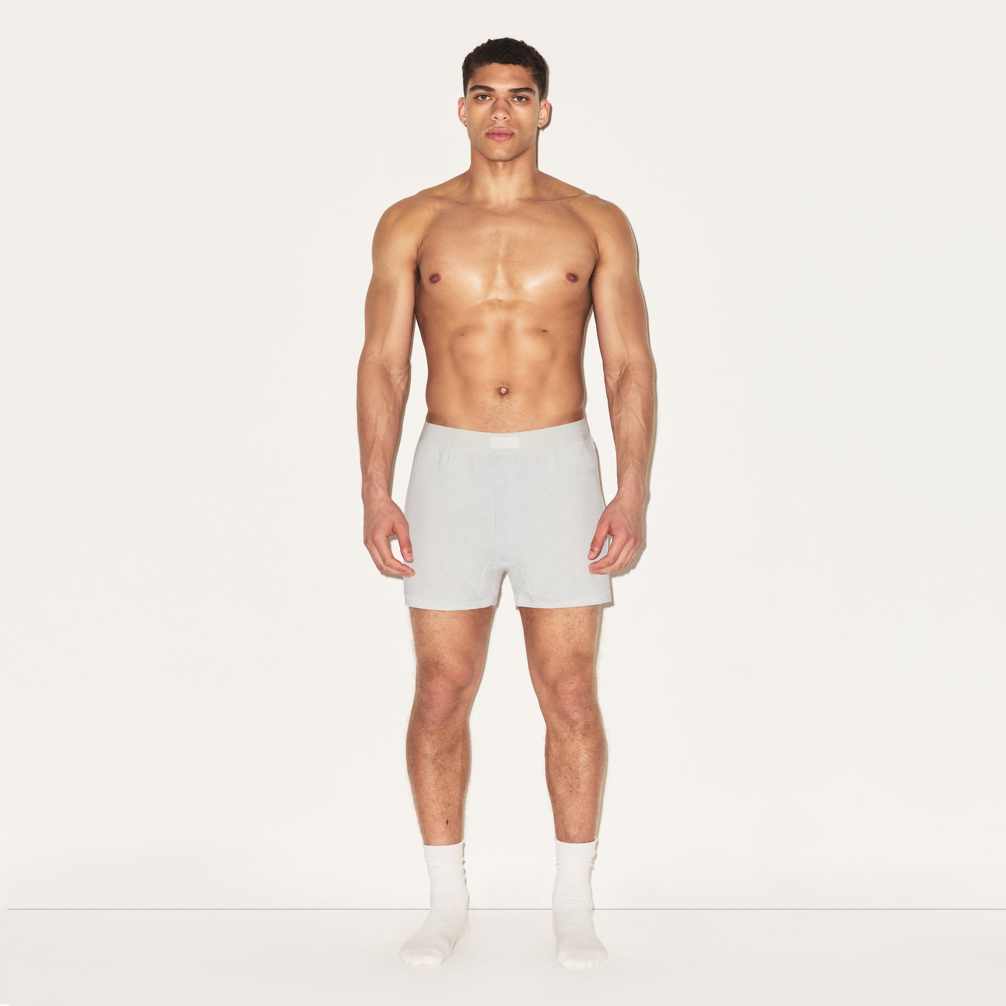 SKIMS COTTON MENS KNIT BOXER 3-PACK | HEATHER MULTI ON A MODEL FRONT VIEW | FOCUS: 0.0, 1.0, 0.9