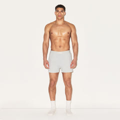 SKIMS COTTON MENS KNIT BOXER 3-PACK | HEATHER MULTI ON A MODEL FRONT VIEW | FOCUS: 0.0, 1.0, 0.9