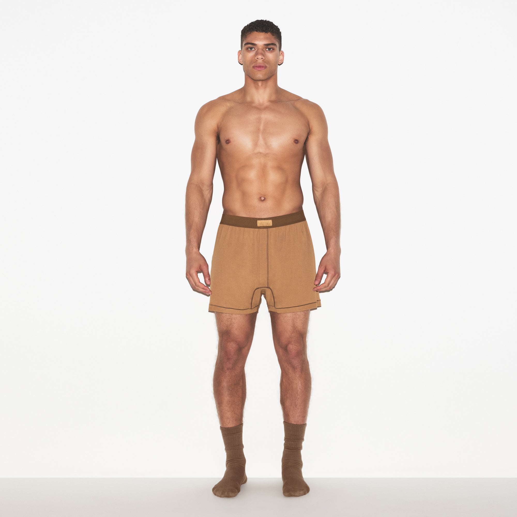 SKIMS COTTON MENS KNIT BOXER 3-PACK | RUSSET MULTI ON A MODEL FRONT VIEW | FOCUS: 0.0, 1.0, 0.9
