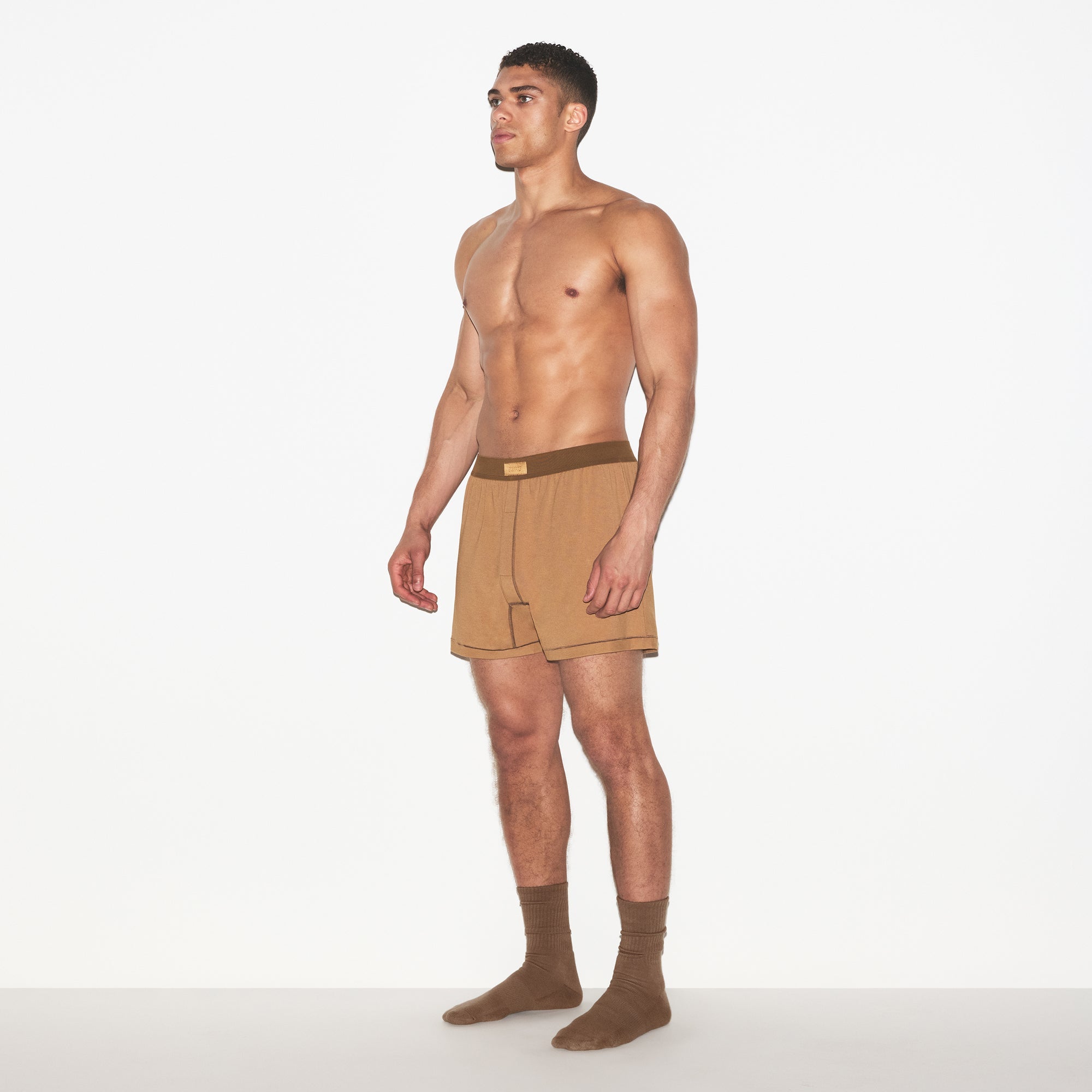 SKIMS COTTON MENS KNIT BOXER 3-PACK | RUSSET MULTI ON A MODEL FRONT VIEW | FOCUS: 0.0, 1.0, 0.9