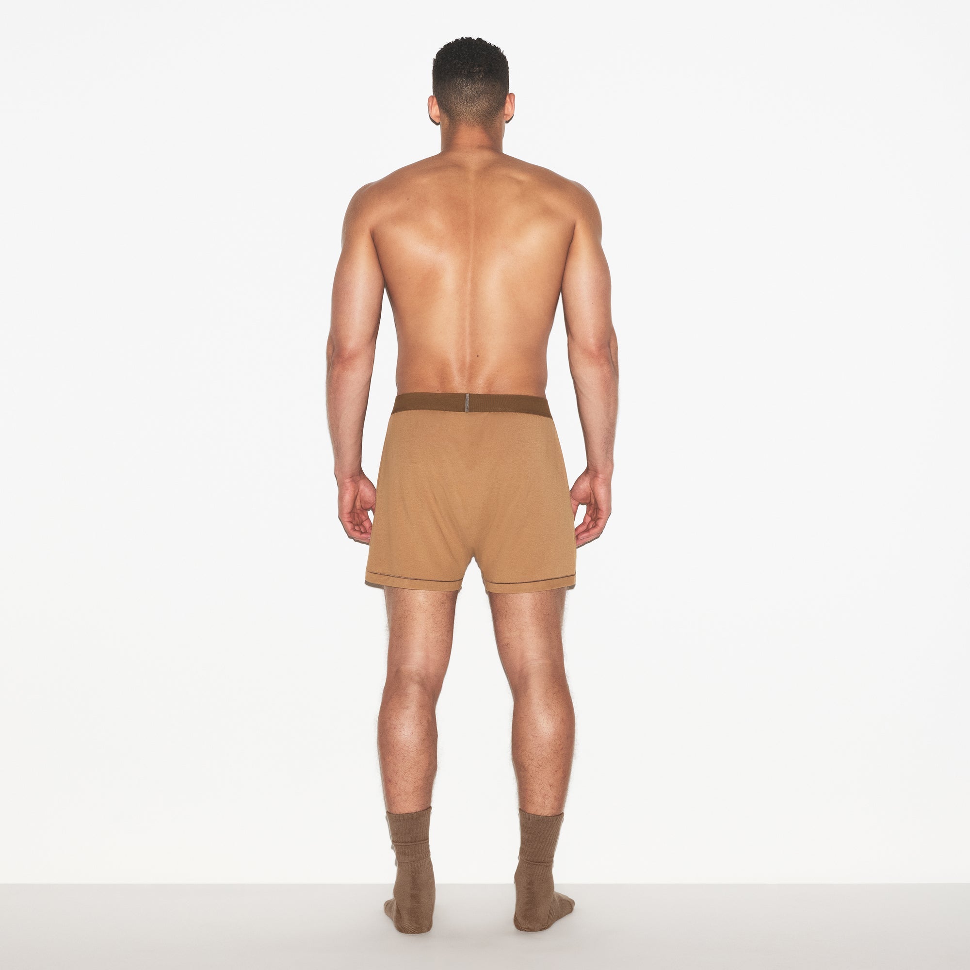 SKIMS COTTON MENS KNIT BOXER 3-PACK | RUSSET MULTI ON A MODEL FRONT VIEW | FOCUS: 0.0, 1.0, 0.9
