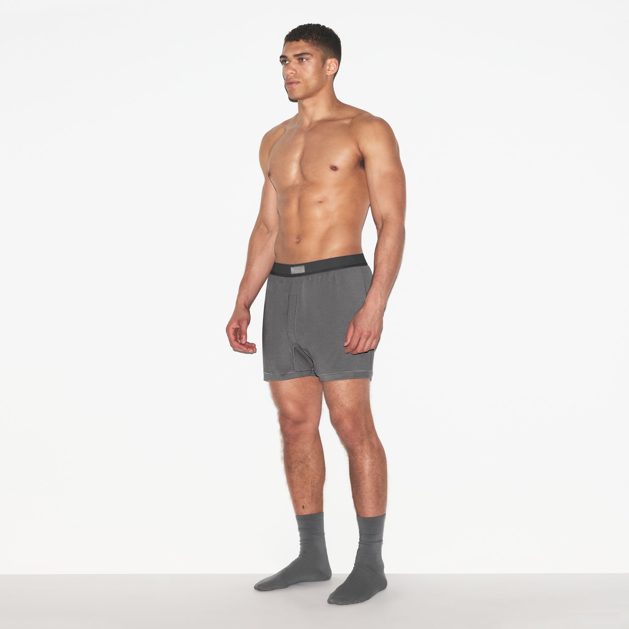 SKIMS COTTON MENS KNIT BOXER 3-PACK | RUSSET MULTI ON A MODEL FRONT VIEW | FOCUS: 0.0, 1.0, 0.9