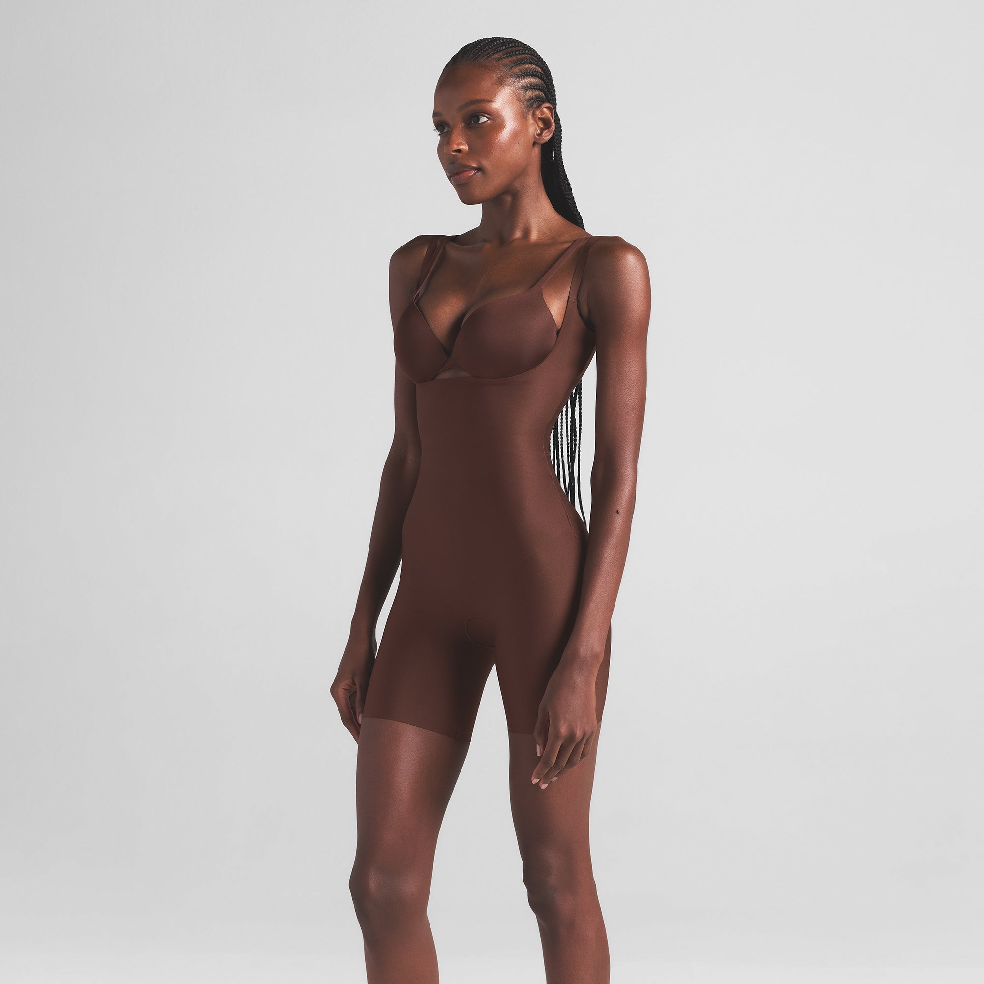 SKIMS BODY CORE SCULPT OPEN BUST MID THIGH BODYSUIT | COCOA ON A MODEL SIDE VIEW