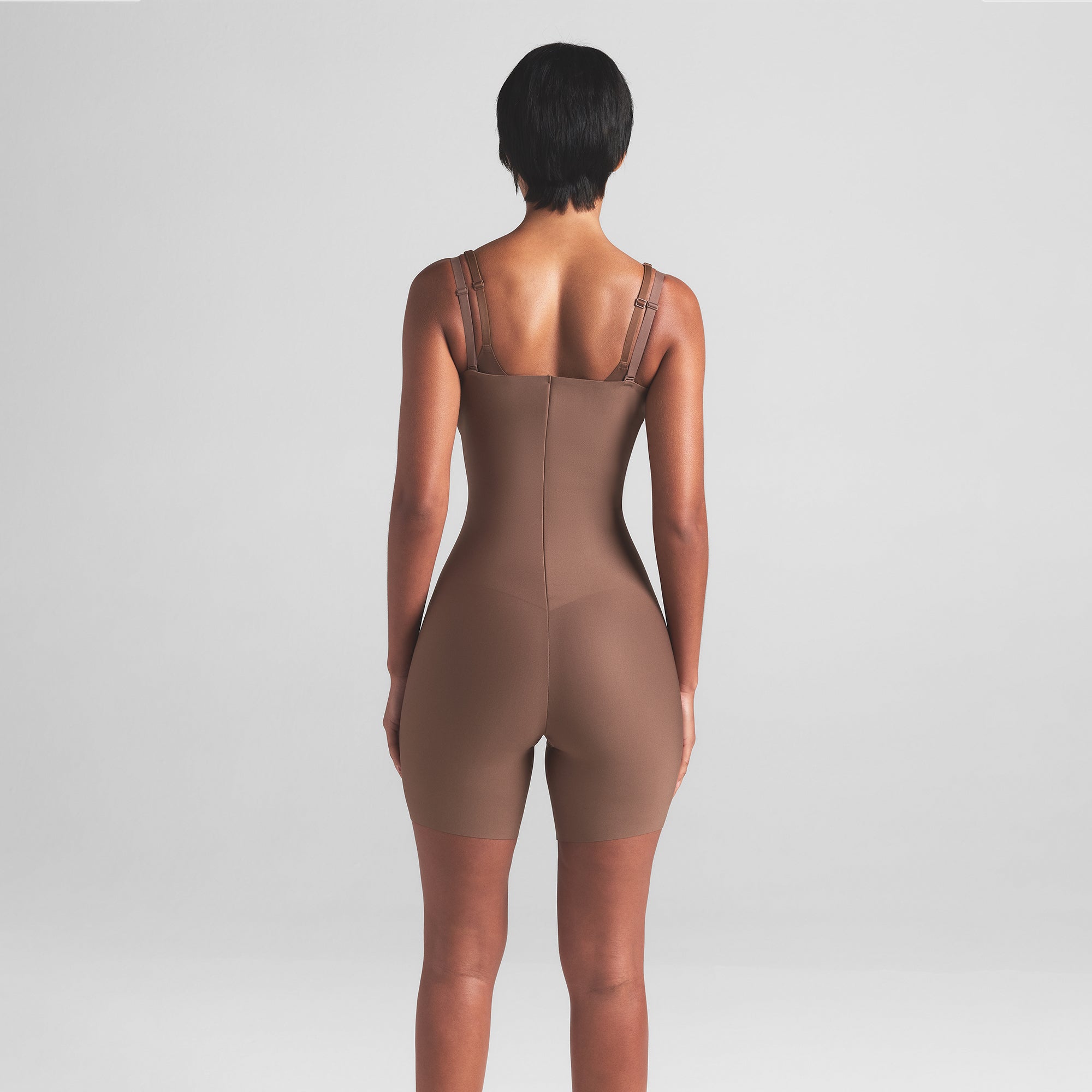 SKIMS BODY CORE SCULPT OPEN BUST MID THIGH BODYSUIT | JASPER ON A MODEL BACK VIEW
