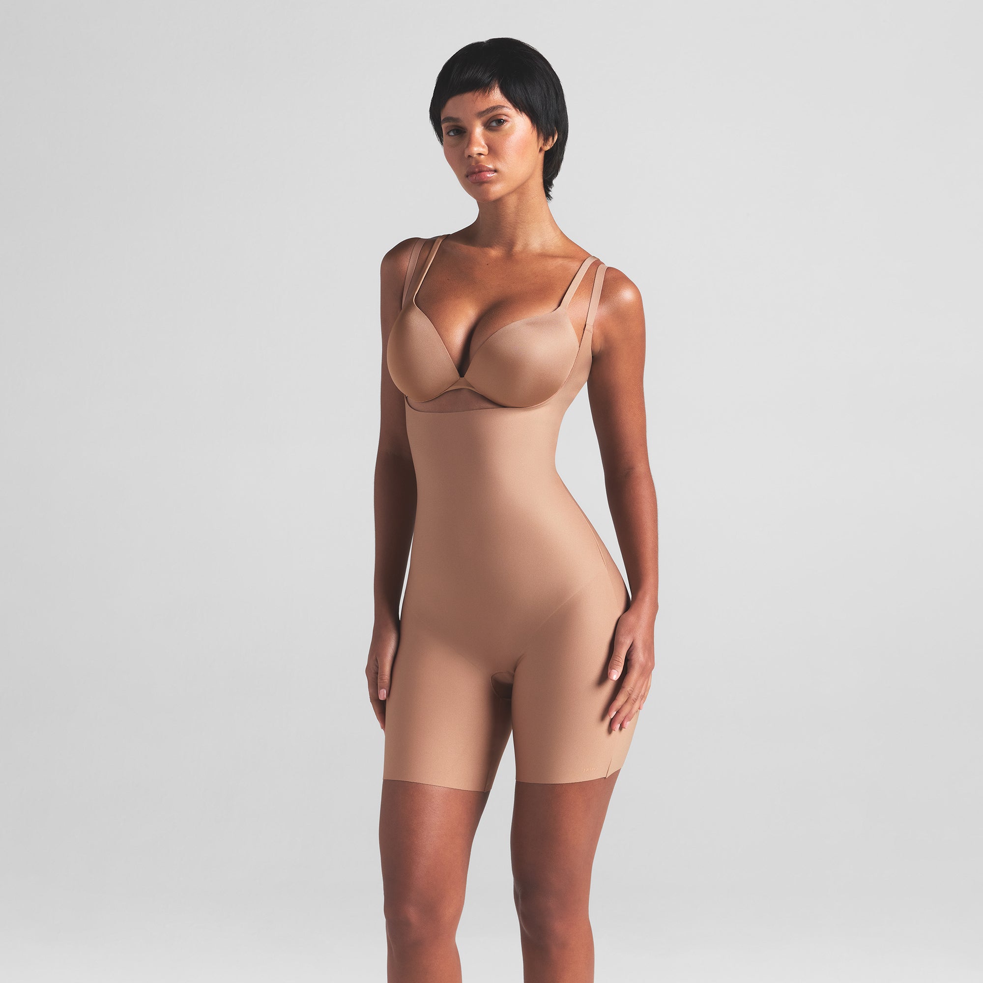 SKIMS BODY CORE SCULPT OPEN BUST MID THIGH BODYSUIT | SIENNA ON A MODEL FRONT VIEW