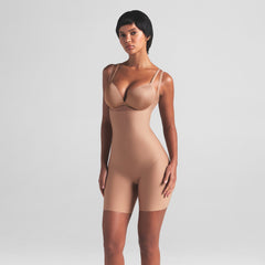 SKIMS BODY CORE SCULPT OPEN BUST MID THIGH BODYSUIT | SIENNA ON A MODEL FRONT VIEW