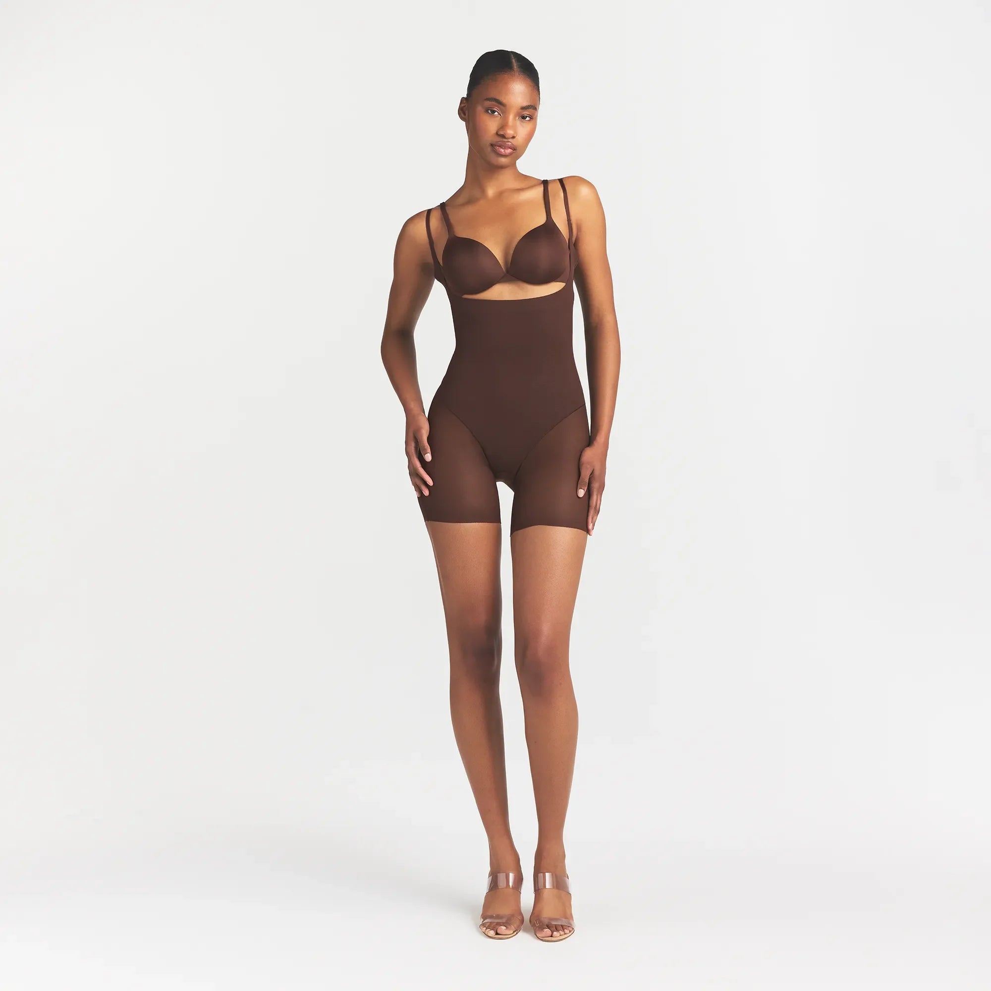 POWER MESH SHAPEWEAR CORE SCULPT OPEN BUST MID THIGH BODYSUIT | COCOA ON A MODEL FRONT VIEW @