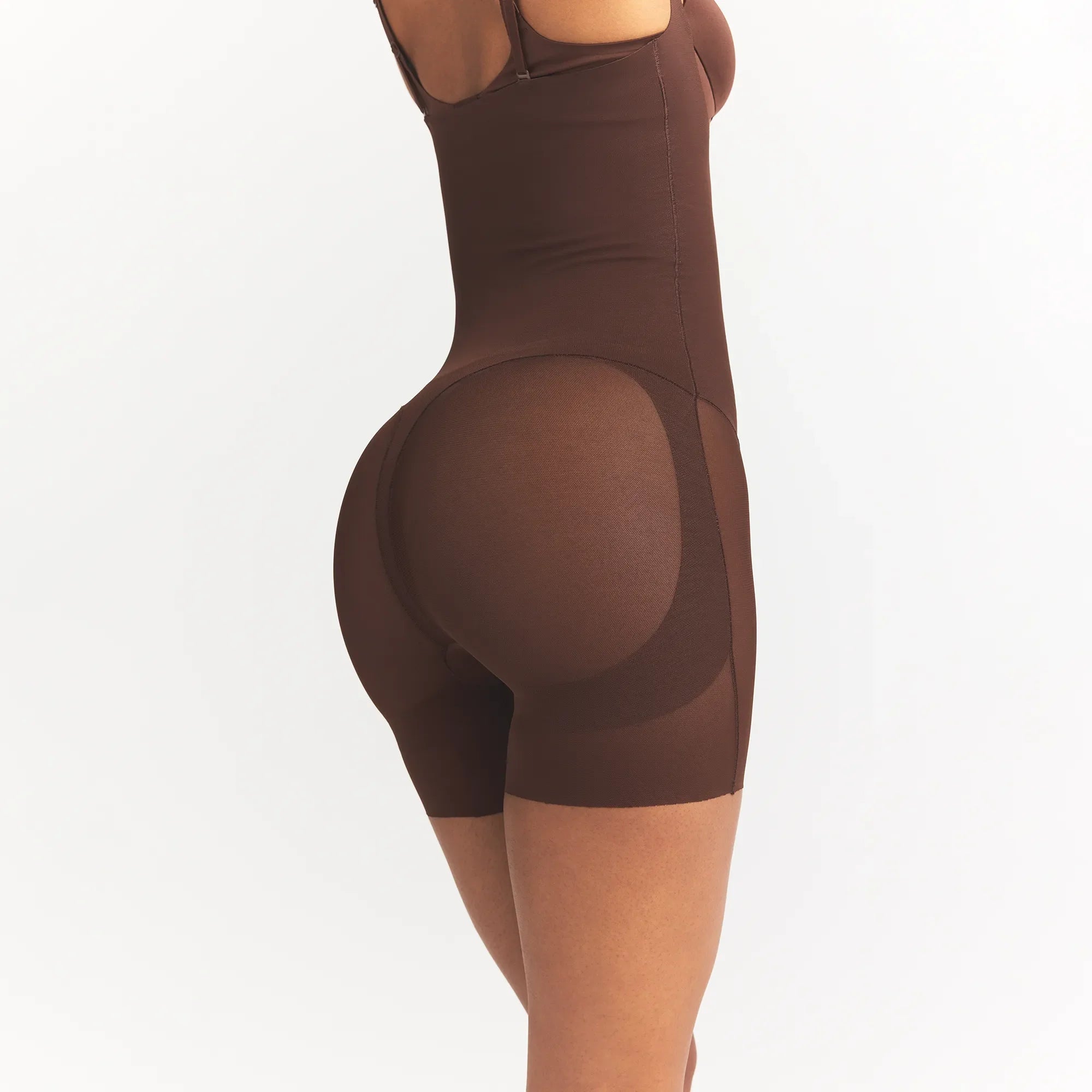 POWER MESH SHAPEWEAR CORE SCULPT OPEN BUST MID THIGH BODYSUIT | COCOA ON A MODEL SIDE VIEW @
