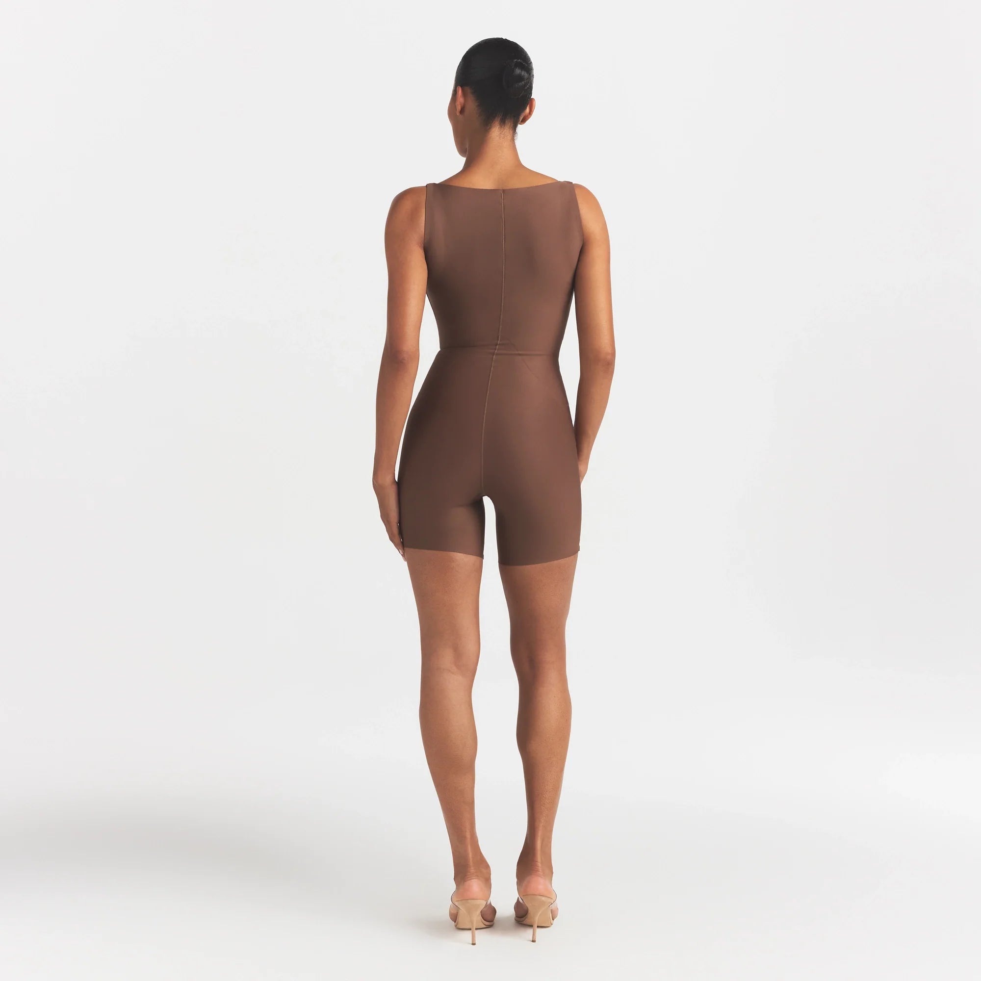 SKIMS BODY CORE SCULPT BACK SMOOTHING OPEN BUST MID THIGH BODYSUIT | JASPER ON A MODEL FRONT VIEW @