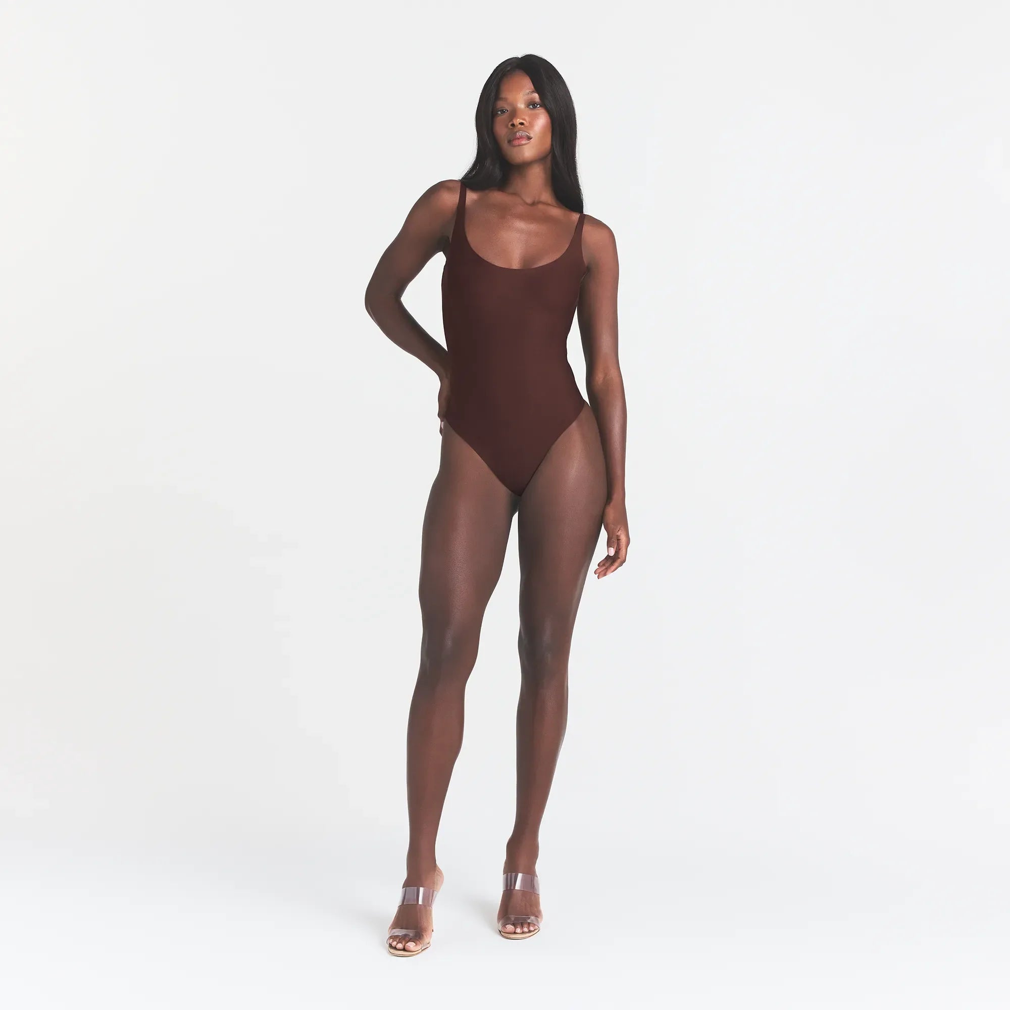 SKIMS BODY SCOOP LOW BACK THONG BODYSUIT | COCOA ON A MODEL FRONT VIEW @