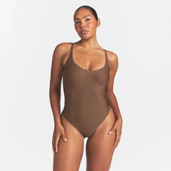 SKIMS BODY SCOOP LOW BACK THONG BODYSUIT | JASPER ON A MODEL FRONT VIEW @