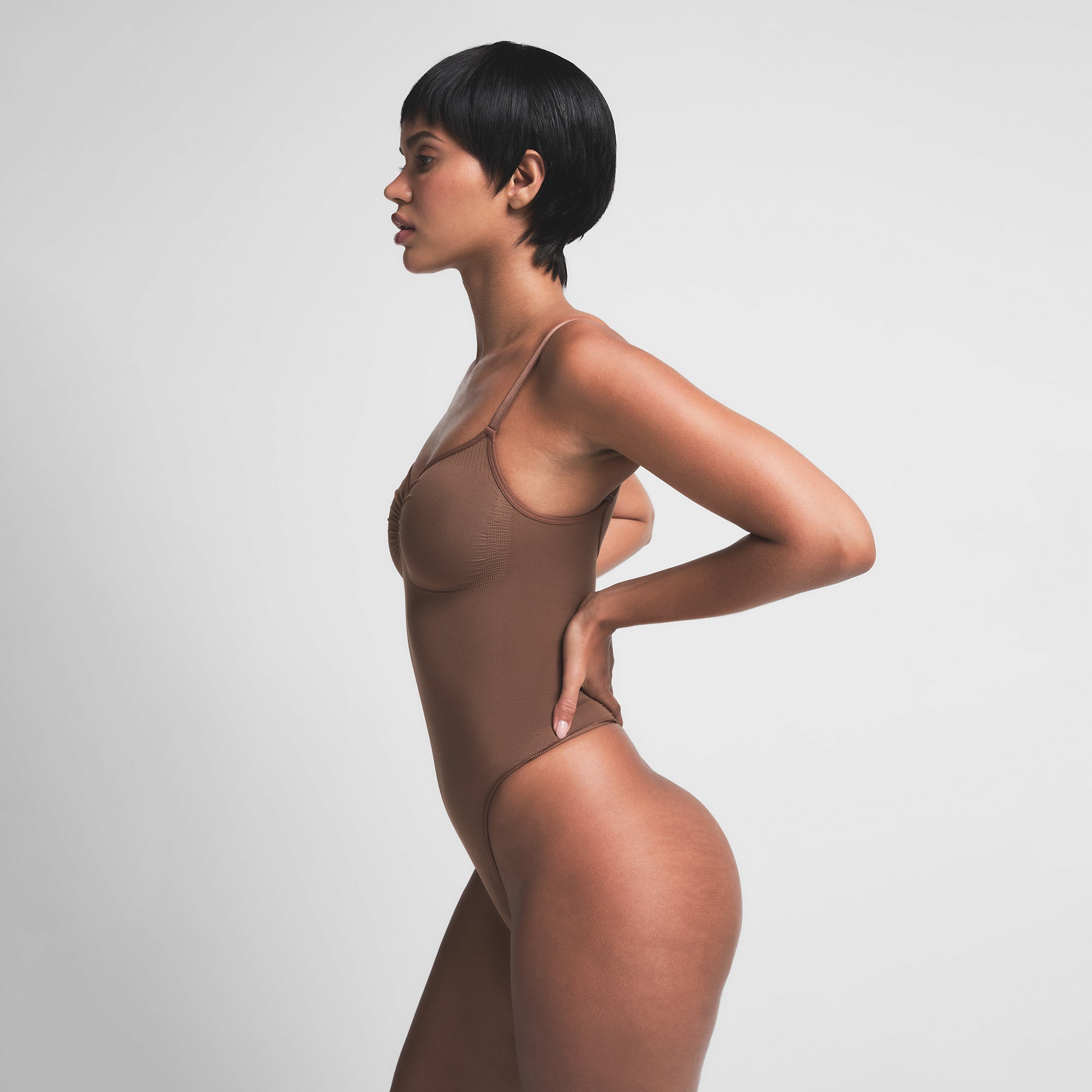 SEAMLESS SCULPT THONG BODYSUIT | JASPER ON A MODEL SIDE VIEW