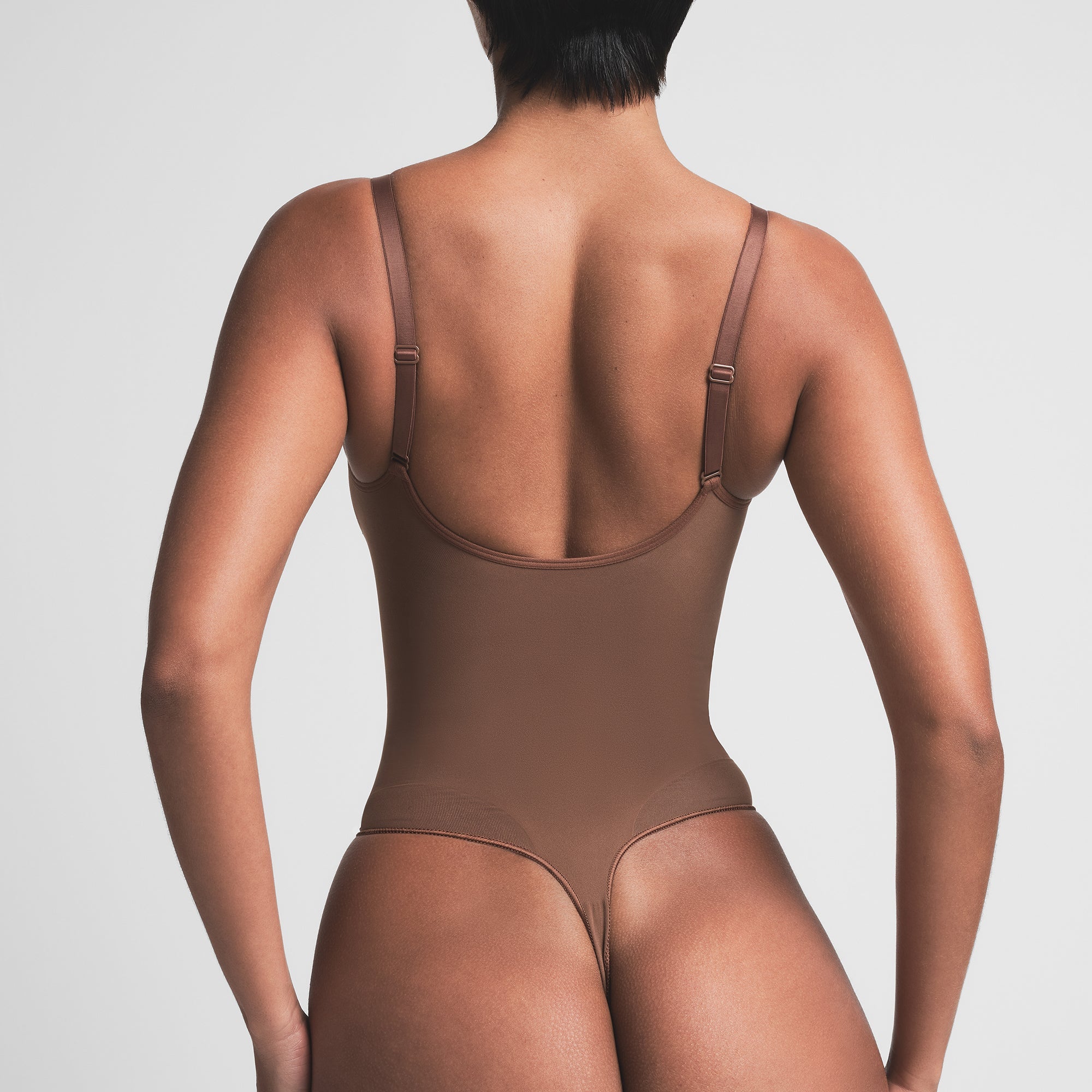SEAMLESS SCULPT THONG BODYSUIT | JASPER ON A MODEL BACK VIEW