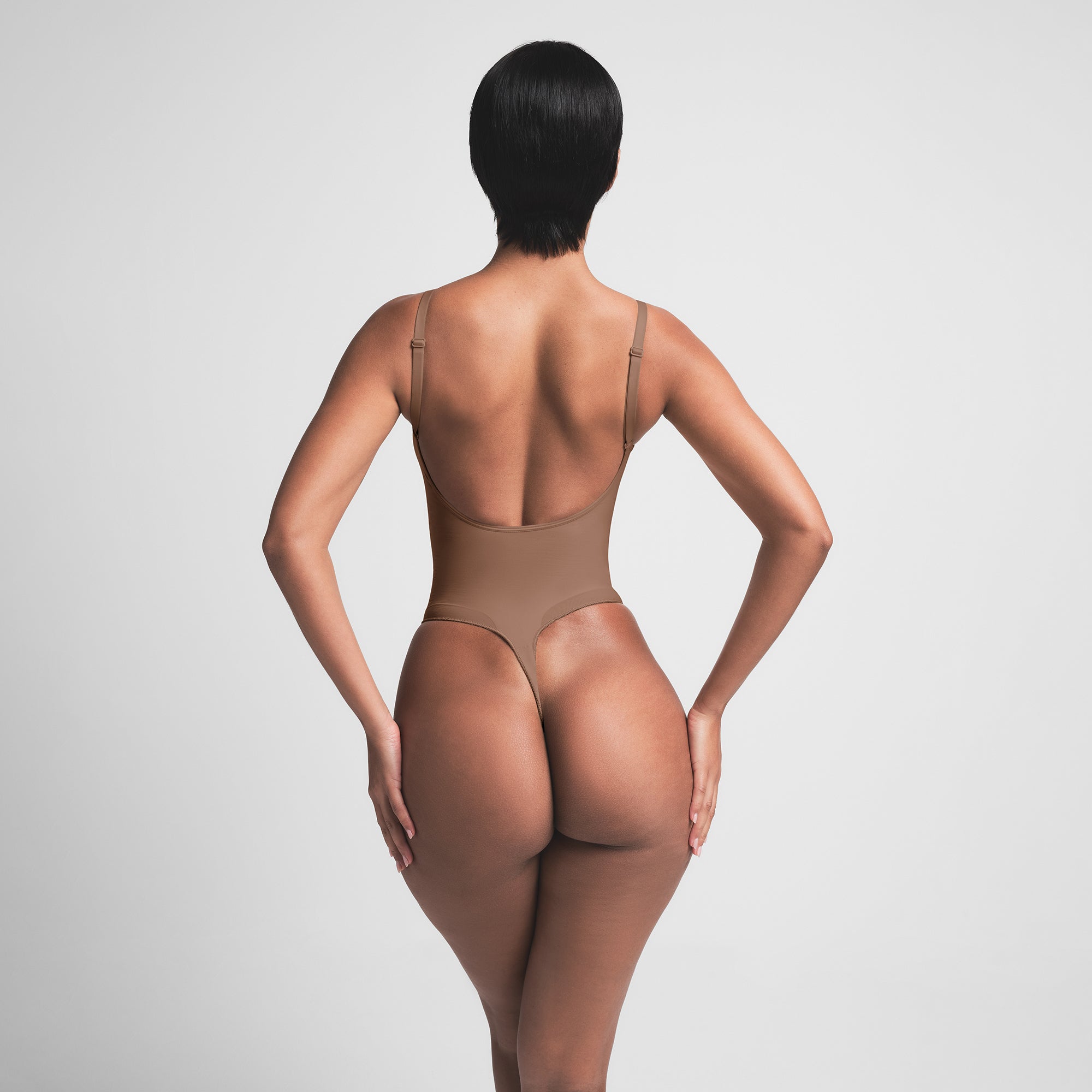SEAMLESS SCULPT LOW BACK THONG BODYSUIT | JASPER ON A MODEL BACK VIEW