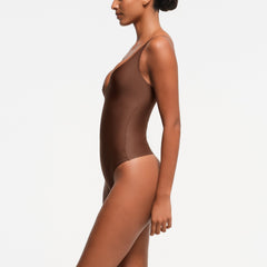 SKIMS BODY ZONED PLUNGE BODYSUIT | JASPER ON A MODEL SIDE VIEW