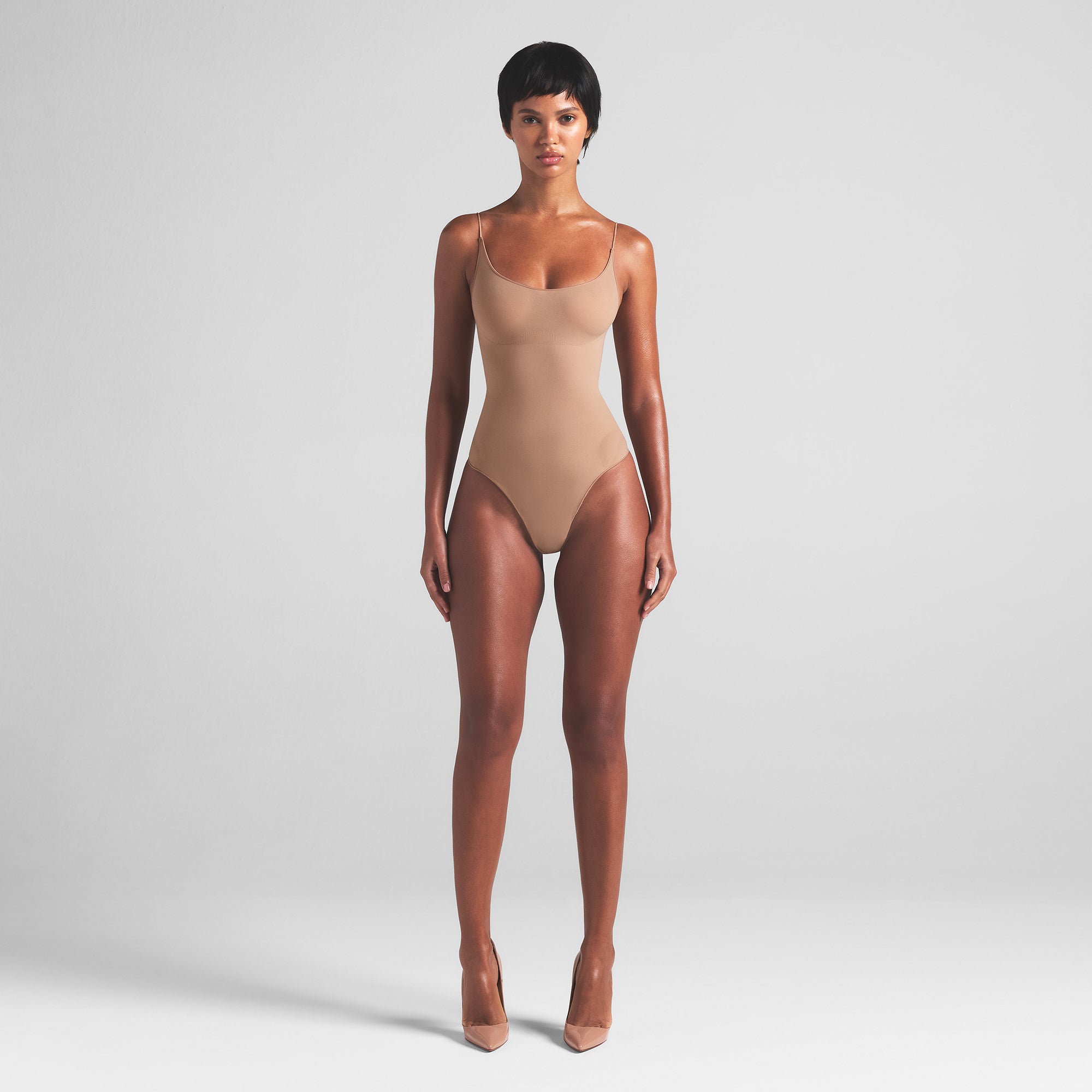 SHEER SEAMLESS THONG BODYSUIT | SIENNA ON A MODEL FRONT VIEW