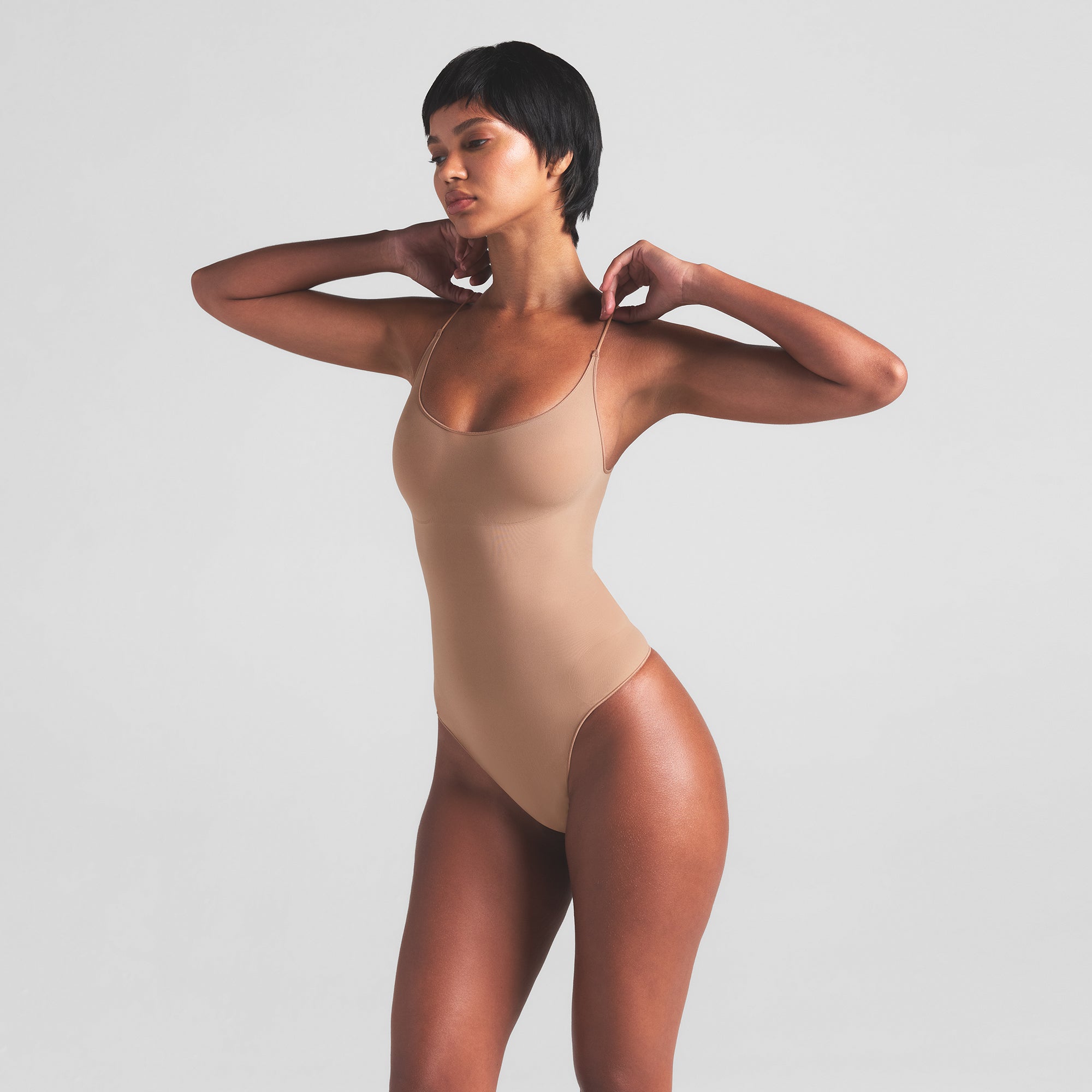 SHEER SEAMLESS THONG BODYSUIT | SIENNA ON A MODEL SIDE VIEW