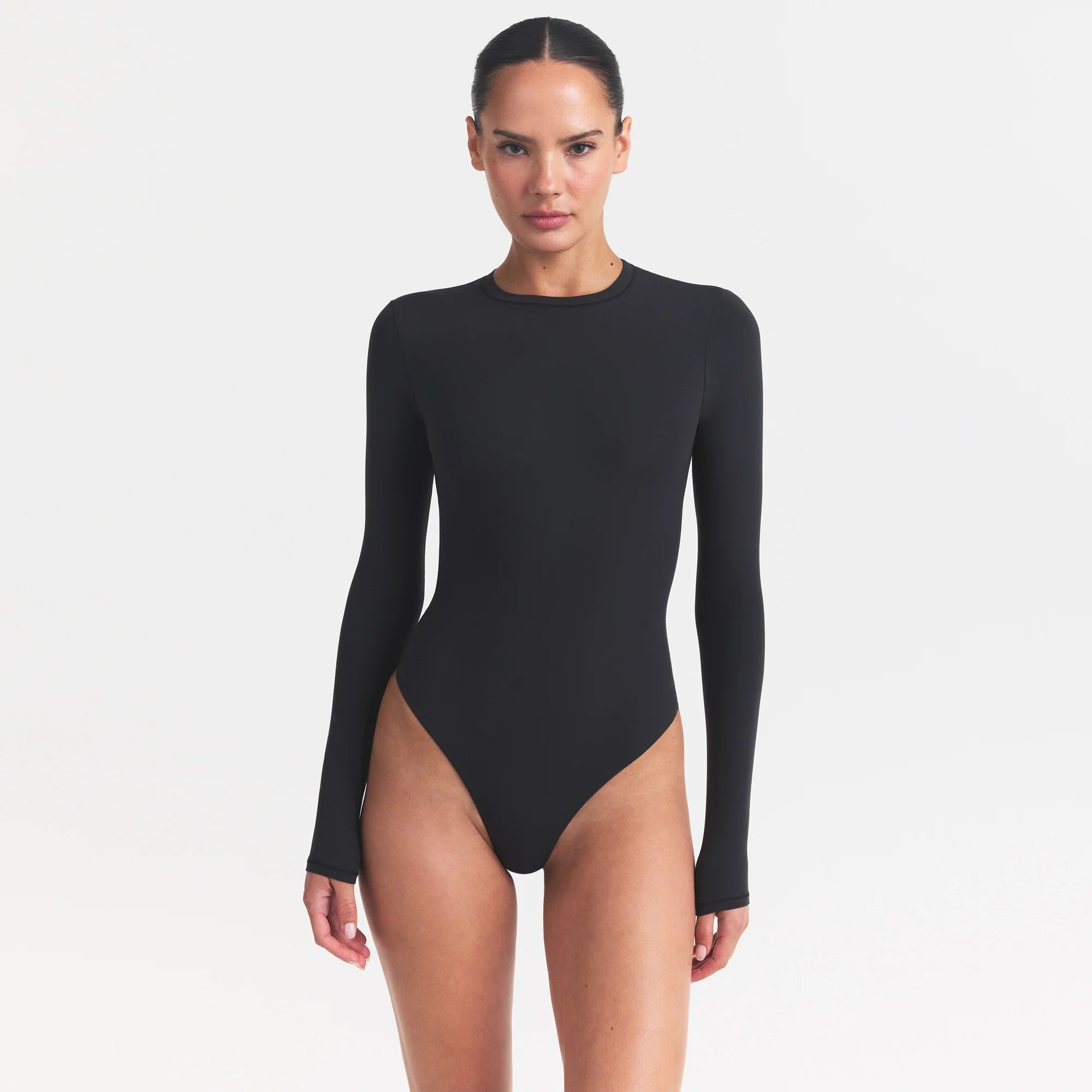 FITS EVERYBODY LONG SLEEVE CREW NECK BODYSUIT | ONYX ON A MODEL SIDE VIEW @ | FOCUS: 0.0, 1.0, 0.9